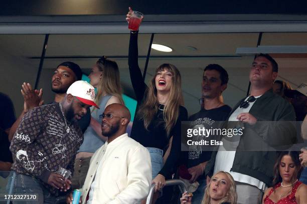 Singer Taylor Swift cheers prior to the game between the Kansas City Chiefs and the New York Jets at MetLife Stadium on October 01, 2023 in East...