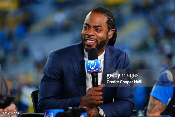 Richard Sherman looks on from the Amazon Prime pregame show set prior to an NFL football game at Lambeau Field on September 28, 2023 in Green Bay,...