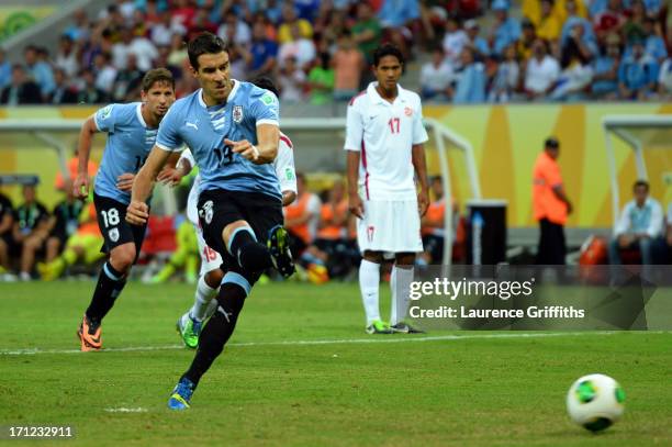 Andres Scotti of Uruguay takes a penalty kick during the FIFA Confederations Cup Brazil 2013 Group B match between Uruguay and Tahiti at Arena...