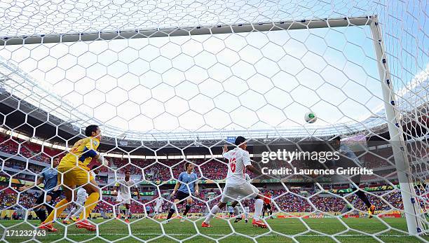 Abel Hernandez of Uruguay scores a goal against Gilbert Meriel and Ricky Aitamai of Tahiti during the FIFA Confederations Cup Brazil 2013 Group B...