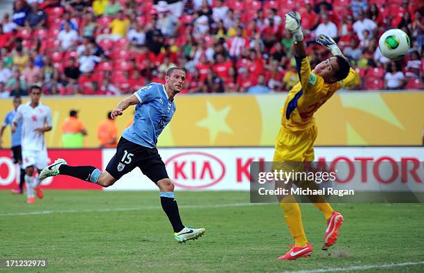 Diego Perez of Uruguay competes against Gilbert Meriel of Tahiti during the FIFA Confederations Cup Brazil 2013 Group B match between Uruguay and...