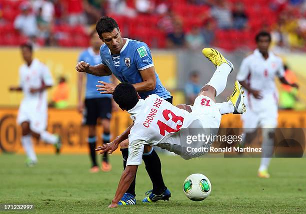 Andres Scotti of Uruguay against Edson Lemaire of Tahiti during the FIFA Confederations Cup Brazil 2013 Group B match between Uruguay and Tahiti at...