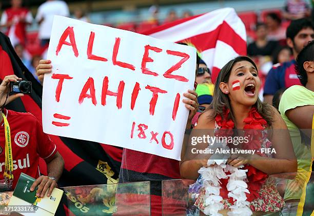 Fan cheers during the FIFA Confederations Cup Brazil 2013 Group B match between Uruguay and Tahiti at Arena Pernambuco on June 22, 2013 in Recife,...