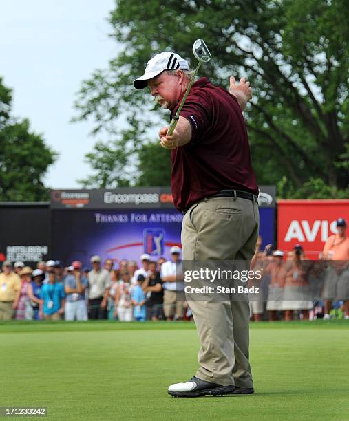 Craig Stadler reacts to his putt on the 18th green winning the final round of the Encompass Championship at North Shore Country Club on June 23, 2013...