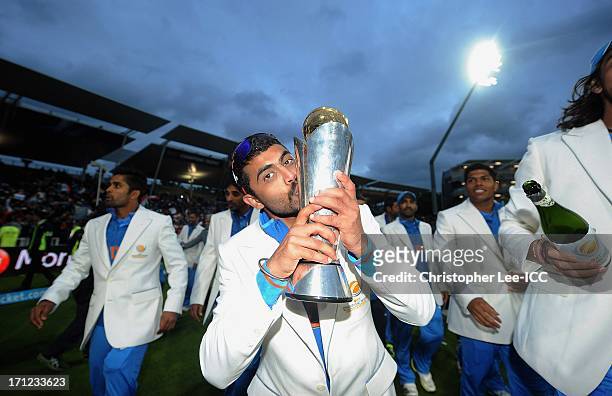 Ravindra Jadeja of India celebratse their victory by kissing the Champions Trophy after the ICC Champions Trophy Final match between England and...