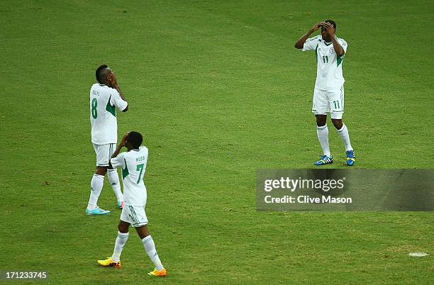 Ahmed Musa , Brown Ideye and Mohammed Gambo of Nigeria show their dejection during the FIFA Confederations Cup Brazil 2013 Group B match between...