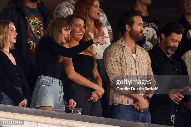 Singer Taylor Swift and Actor Ryan Reynolds look on prior to the game between the Kansas City Chiefs and the New York Jets at MetLife Stadium on...