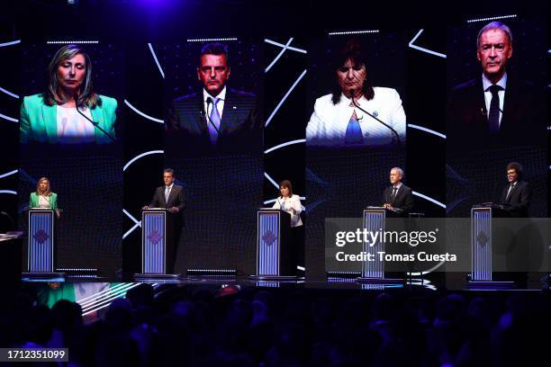 Presidential candidates stand on stage during a presidential debate on October 01, 2023 in Santiago del Estero, Argentina. Argentinians will head to...