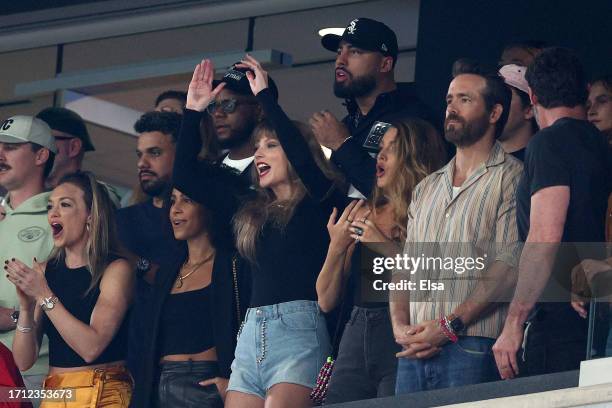 Singer Taylor Swift, Actors Blake Lively and Ryan Reynolds cheer prior to the game between the Kansas City Chiefs and the New York Jets at MetLife...
