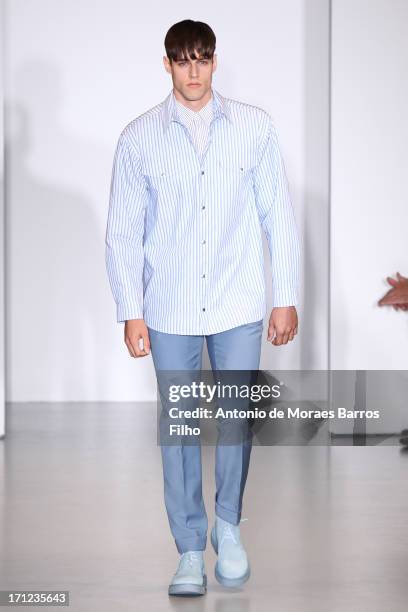 Model walks the runway during the Calvin Klein show as a part of Milan Fashion Week S/S 2014 on June 23, 2013 in Milan, Italy.