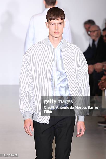 Model walks the runway during the Calvin Klein show as a part of Milan Fashion Week S/S 2014 on June 23, 2013 in Milan, Italy.