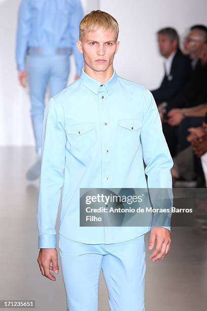 Model walks the runway during the Calvin Klein show as a part of Milan Fashion Week S/S 2014 on June 23, 2013 in Milan, Italy.