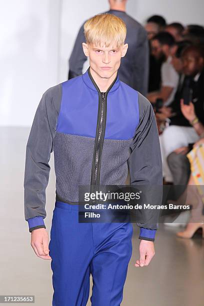 Model walks the runway during the Calvin Klein show as a part of Milan Fashion Week S/S 2014 on June 23, 2013 in Milan, Italy.