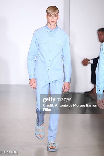 Model walks the runway during the Calvin Klein show as a part of Milan Fashion Week S/S 2014 on June 23, 2013 in Milan, Italy.