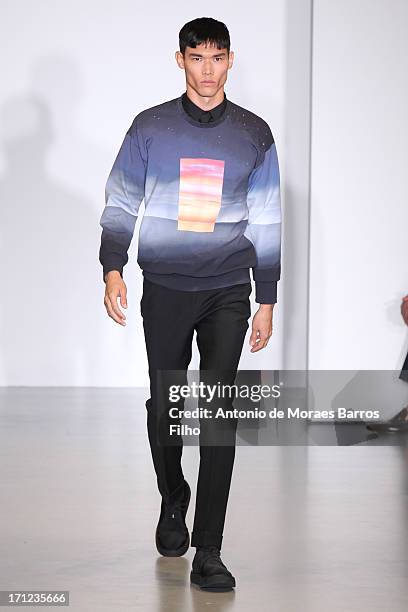 Model walks the runway during the Calvin Klein show as a part of Milan Fashion Week S/S 2014 on June 23, 2013 in Milan, Italy.