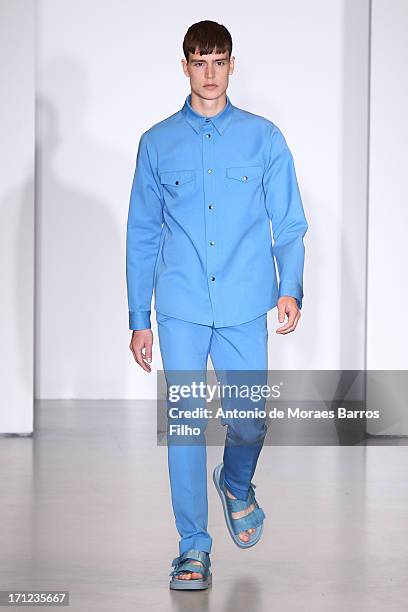 Model walks the runway during the Calvin Klein show as a part of Milan Fashion Week S/S 2014 on June 23, 2013 in Milan, Italy.