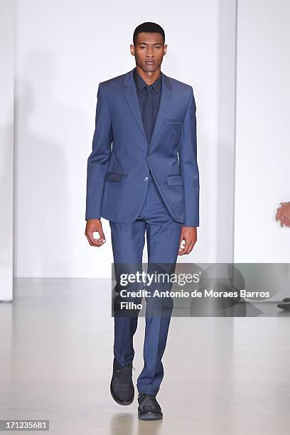 Model walks the runway during the Calvin Klein show as a part of Milan Fashion Week S/S 2014 on June 23, 2013 in Milan, Italy.