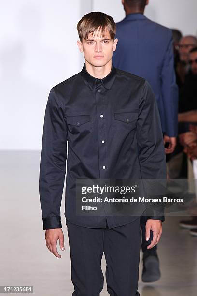 Model walks the runway during the Calvin Klein show as a part of Milan Fashion Week S/S 2014 on June 23, 2013 in Milan, Italy.