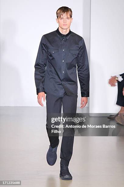 Model walks the runway during the Calvin Klein show as a part of Milan Fashion Week S/S 2014 on June 23, 2013 in Milan, Italy.