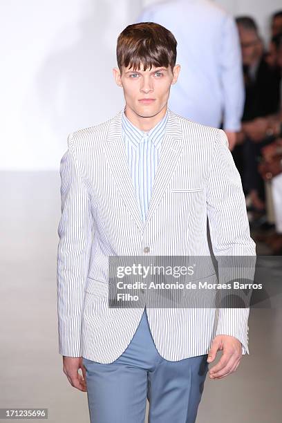 Model walks the runway during the Calvin Klein show as a part of Milan Fashion Week S/S 2014 on June 23, 2013 in Milan, Italy.