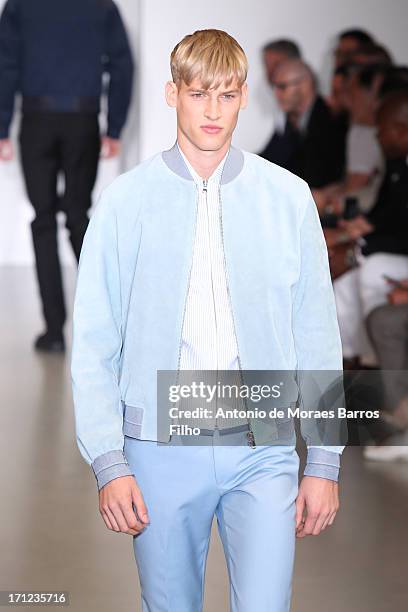 Model walks the runway during the Calvin Klein show as a part of Milan Fashion Week S/S 2014 on June 23, 2013 in Milan, Italy.