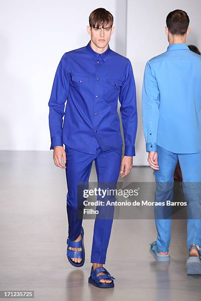 Model walks the runway during the Calvin Klein show as a part of Milan Fashion Week S/S 2014 on June 23, 2013 in Milan, Italy.