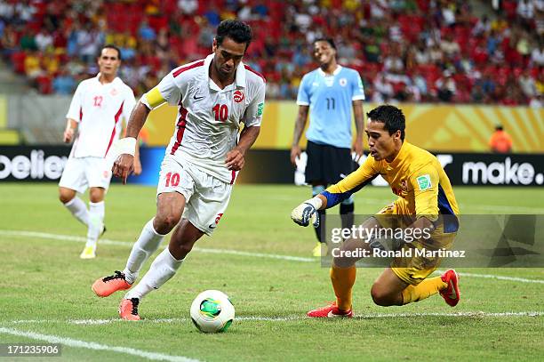 Nicolas Vallar and Gilbert Meriel of Tahiti in action during the FIFA Confederations Cup Brazil 2013 Group B match between Uruguay and Tahiti at...