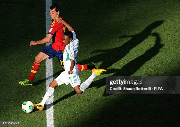 Ahmed Musa of Nigeria shoots past Alvaro Arbeloa of Spain during the FIFA Confederations Cup Brazil 2013 Group B match between Nigeria and Spain at...