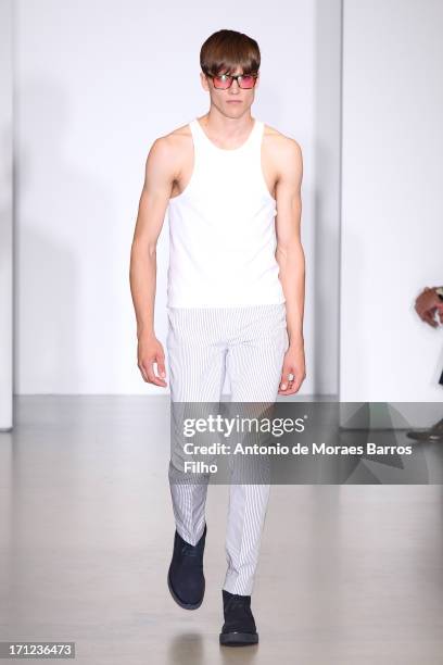 Model walks the runway during the Calvin Klein show as a part of Milan Fashion Week S/S 2014 on June 23, 2013 in Milan, Italy.