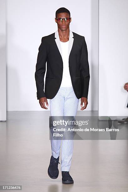 Model walks the runway during the Calvin Klein show as a part of Milan Fashion Week S/S 2014 on June 23, 2013 in Milan, Italy.