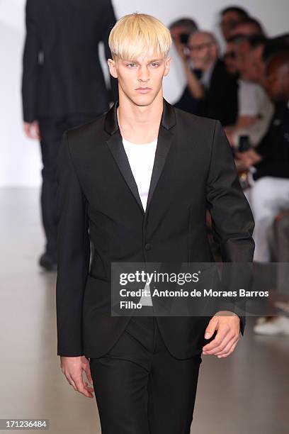 Model walks the runway during the Calvin Klein show as a part of Milan Fashion Week S/S 2014 on June 23, 2013 in Milan, Italy.