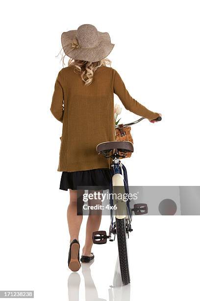 woman walking with a bicycle - blonde hair rear white background stock pictures, royalty-free photos & images