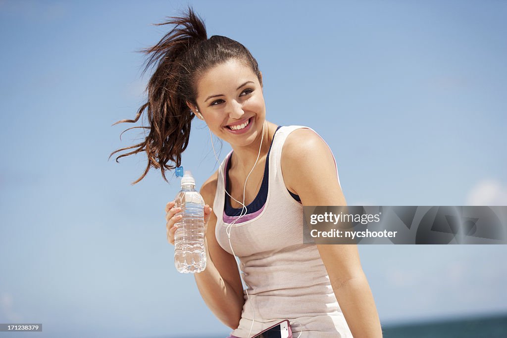 Teenage girl drinking water