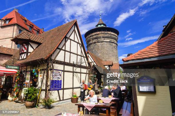 lunch and music at the handwerkerhof nuremberg - franconia stock pictures, royalty-free photos & images