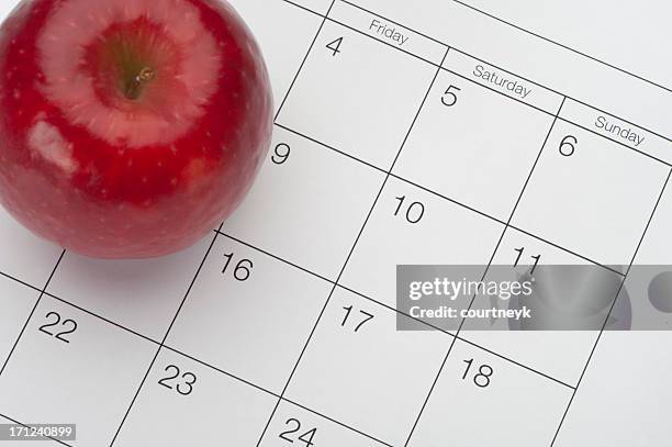 dieting concept - apple and calendar - freshers week stock pictures, royalty-free photos & images