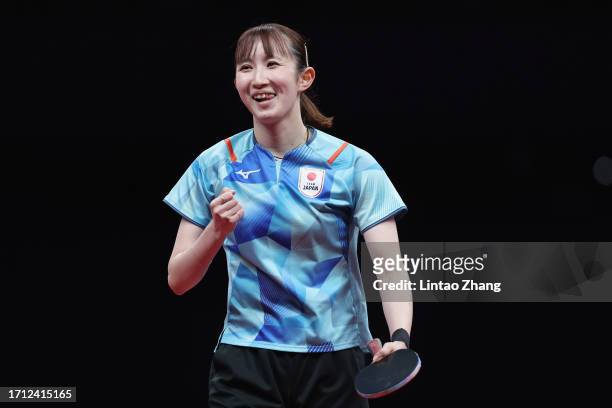 Hina Hayata of Japan reacts competes against Wang Yidi of China in their women's singles semi-finals table tennis match during day 8 of the 2022...