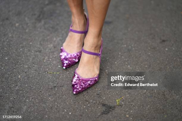 Guest wears glittering purple sequined pointy pumps, outside Fendi, during the Milan Fashion Week - Womenswear Spring/Summer 2024 on September 20,...