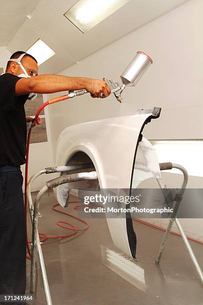 spraying primer on a fender - spray booth stock pictures, royalty-free photos & images