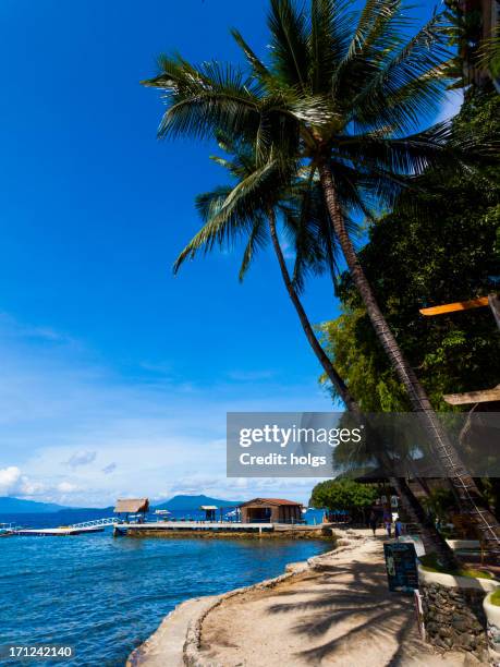 waterside walkway in sabang, puerto galera, philippines - gallera stock pictures, royalty-free photos & images