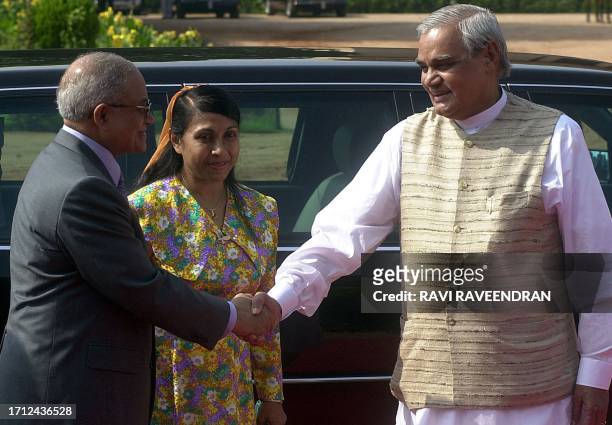 Indian Prime Minister Atal Behari Vajpayee greets President of Maldives Maumon Abdul Gayoom and his wife during a welcome ceremony for the visiting...