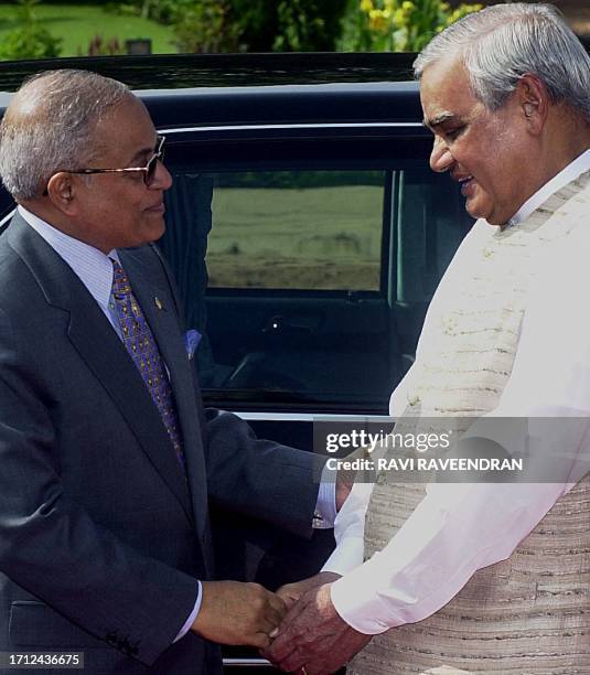 Indian Prime Minister Atal Behari Vajpayee greets President of Maldives Maumon Abdul Gayoom during a welcome ceremony for the visiting President at...