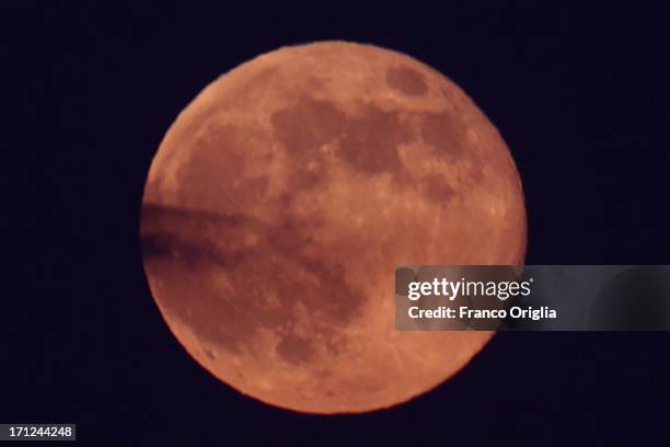 View of the full moon over the sky of Rome on June 23, 2013 in Rome, Italy. Tonight a pink full moon was expected to appear in the sky of Rome. The...