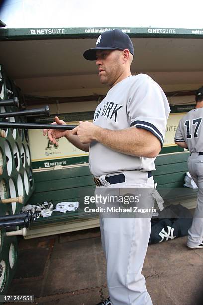 Kevin Youkilis of the New York Yankees stands in the dugout prior to the game against the Oakland Athletics at O.co Coliseum on June 11, 2013 in...