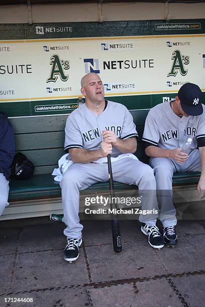 Kevin Youkilis of the New York Yankees sits in the dugout prior to the game against the Oakland Athletics at O.co Coliseum on June 12, 2013 in...