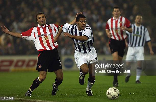 Adam Chambers of West Bromwich Albion skips past Michael Gray of Sunderland during the FA Barclaycard Premiership match between West Bromwich Albion...