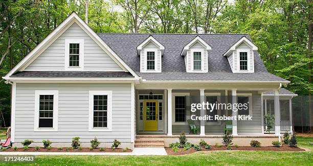 exterior of new suburban house - cape cod stock pictures, royalty-free photos & images