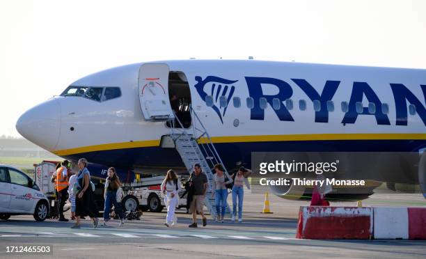 Passengers disembark from the front door of a Boeing 737 MAX from Ryanair on October 2, 2023 in Brussels Airport Zaventem, Belgium. Today Ryanair CEO...