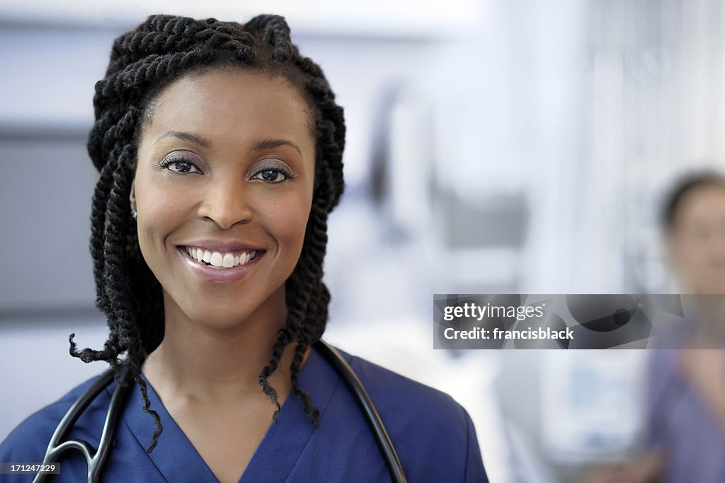 Beautiful ethnic female doctor examining a patient.