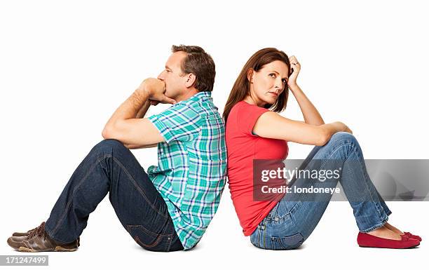 mature couple sitting together - isolated - annoyed wife stock pictures, royalty-free photos & images