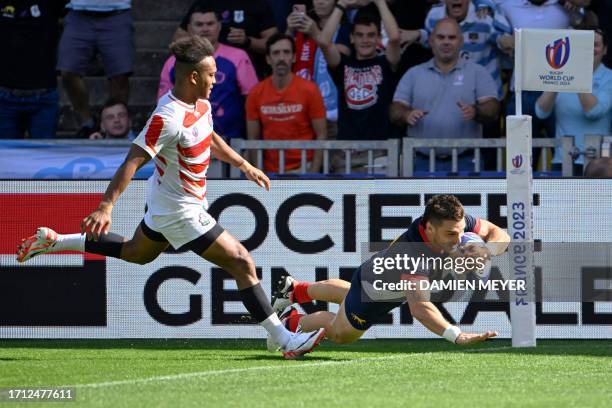 Argentina's left wing Mateo Carreras dives across the line to score a try during the France 2023 Rugby World Cup Pool D match between Japan and...